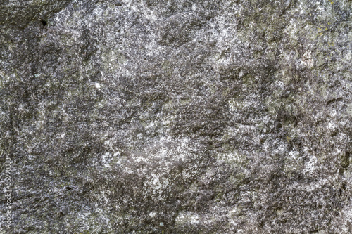 Stone surface with moss texture weather beaten