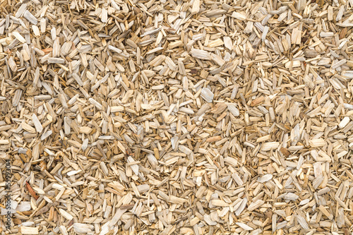 Wooden mulch on the ground in a garden