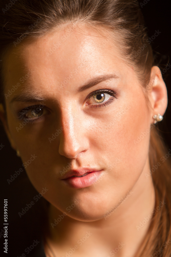 Fototapeta premium Portrait of beautiful woman posing in studio in jacket