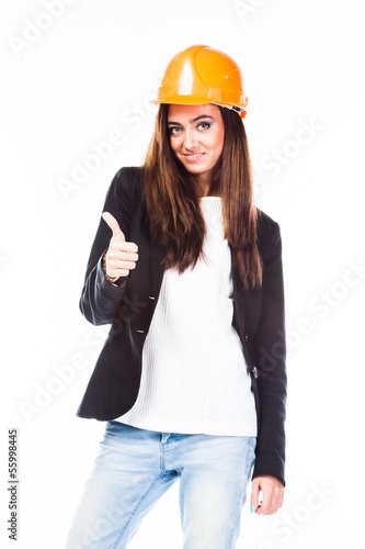 young beautiful woman in yellow construction helmet 
