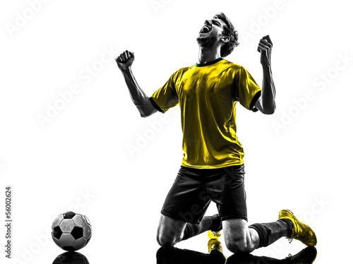 Fototapeta Naklejka Na Ścianę i Meble -  brazilian soccer football player young happiness joy kneeling ma