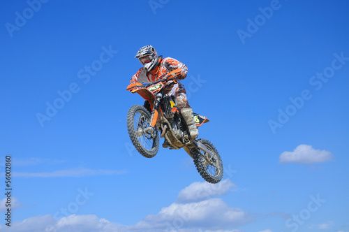 bike jumping on blue sky
