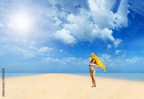 Beautiful Girl With yellow sarong on The Beach.