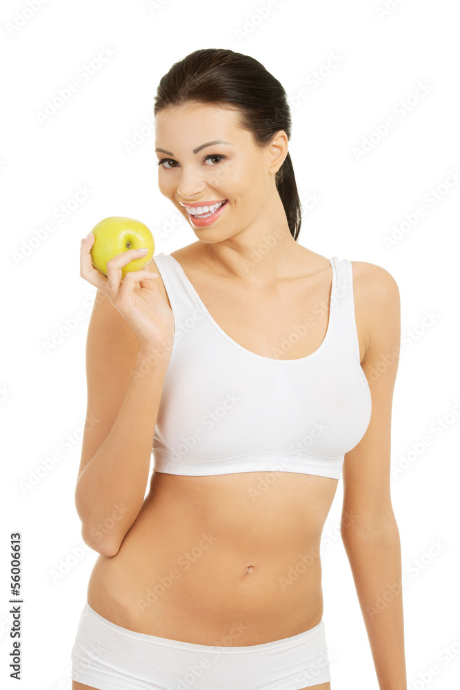 Beautiful woman with clean fresh healthy skin holding green appl Beautiful woman with clean fresh healthy skin holding green appl