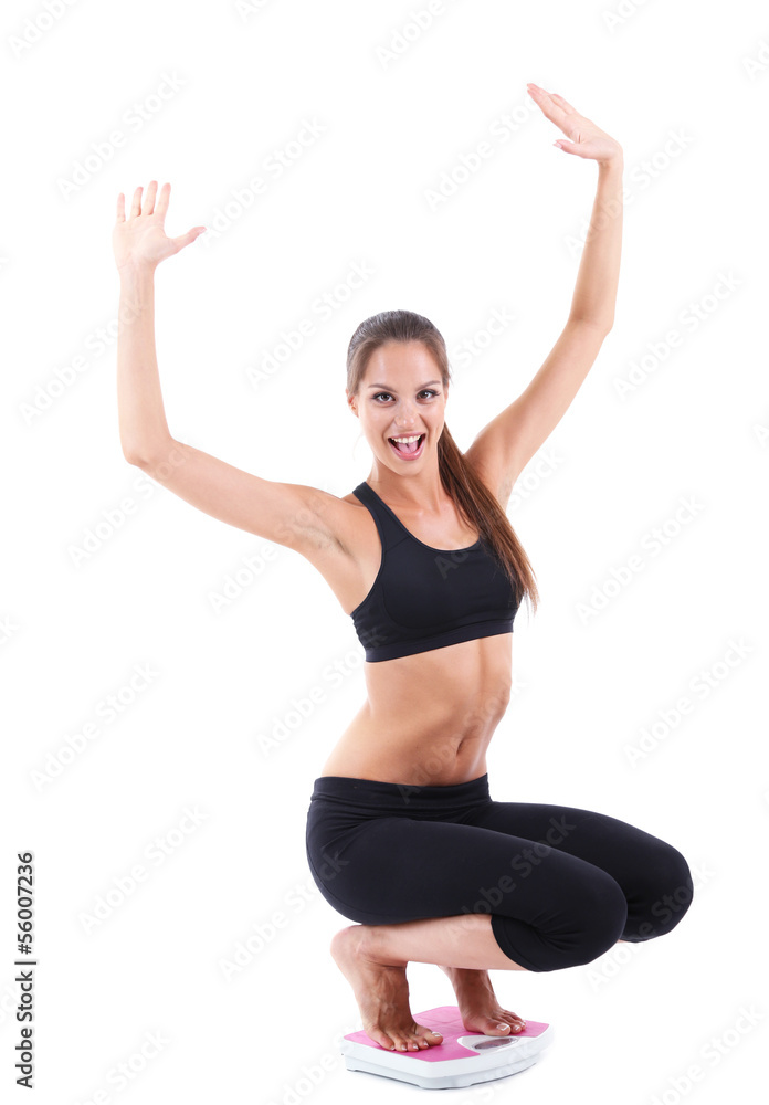 Slim young girl on scales isolated on white Slim young girl on scales isolated on white