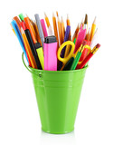 Colorful pencils and other art supplies in pail isolated