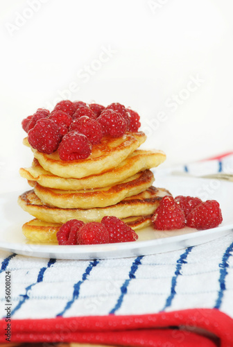 Delicious pancakes with berries and honey