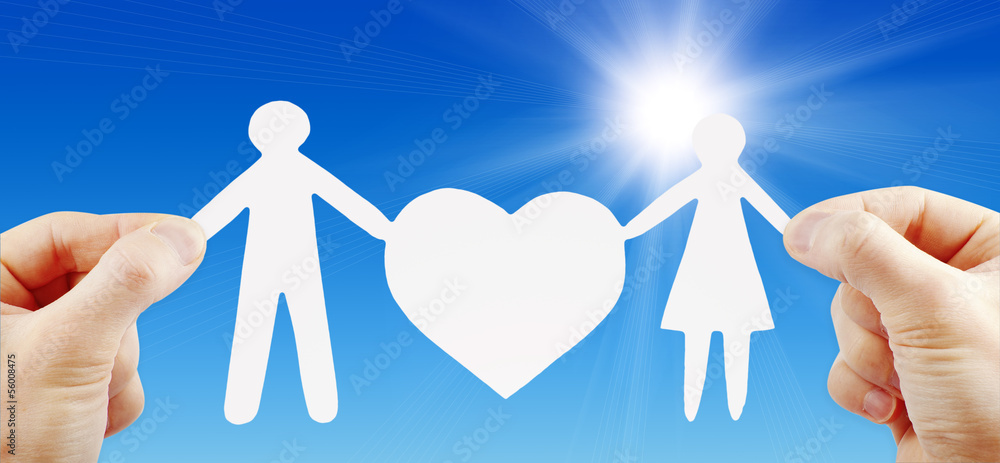 paper family with heart in hands paper family with heart in hands