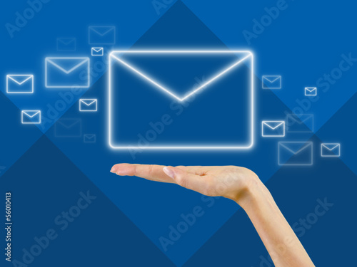 email symbol in the palm of hand,background