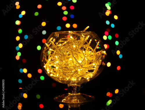 Christmas lights in glass bowl on blur lights background