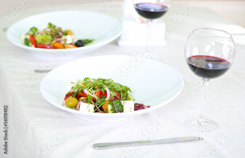 Greek salad on white plate, close up