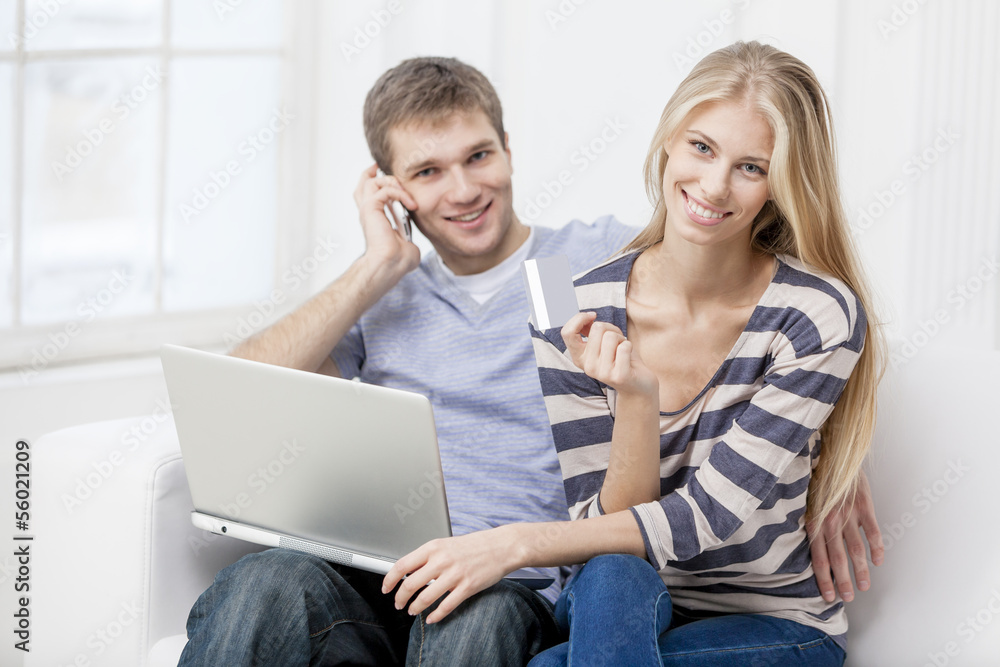 young caucasian couple sitting on couch