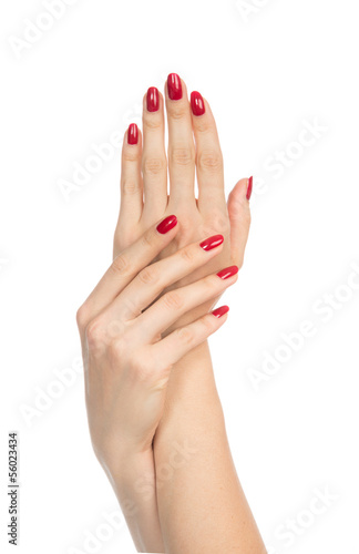 Fotografiet Woman hands with manicured red nails
