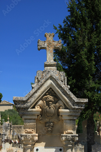 Tombstone with cross ornament at a French cemetery
