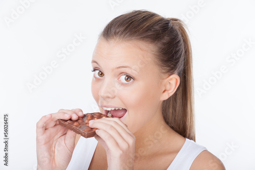 Woman eating chocolate