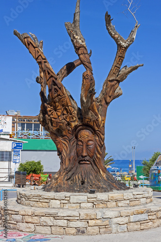 tree carved at matala, the city of hippie's photo