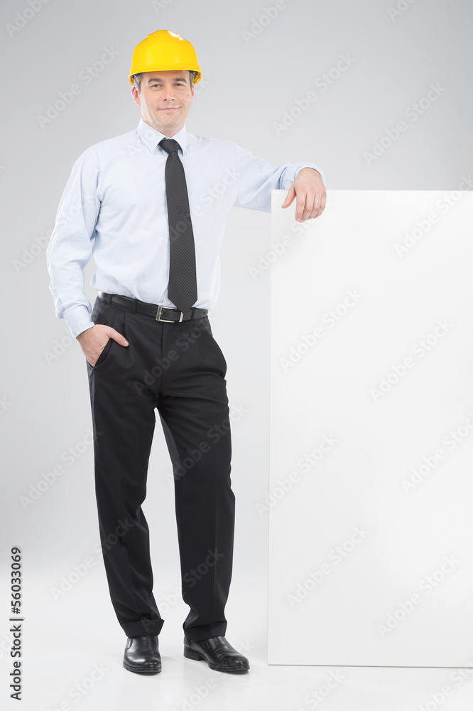 Man in hardhat. Cheerful middle-aged man in formalwear and hardh Man in hardhat. Cheerful middle-aged man in formalwear and hardh