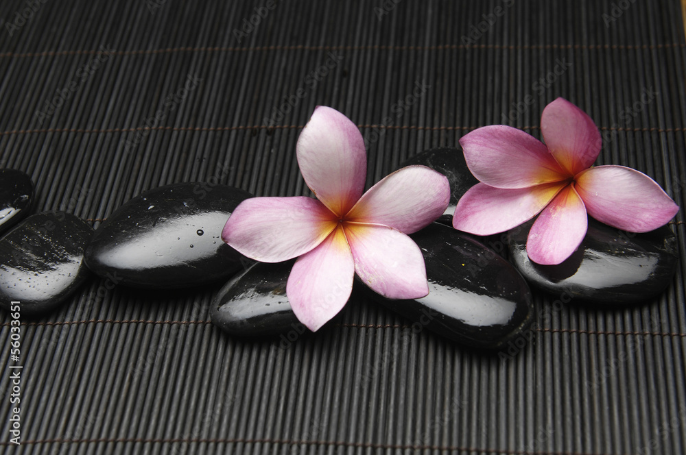 zen stones and frangipani flower on mat zen stones and frangipani flower on mat