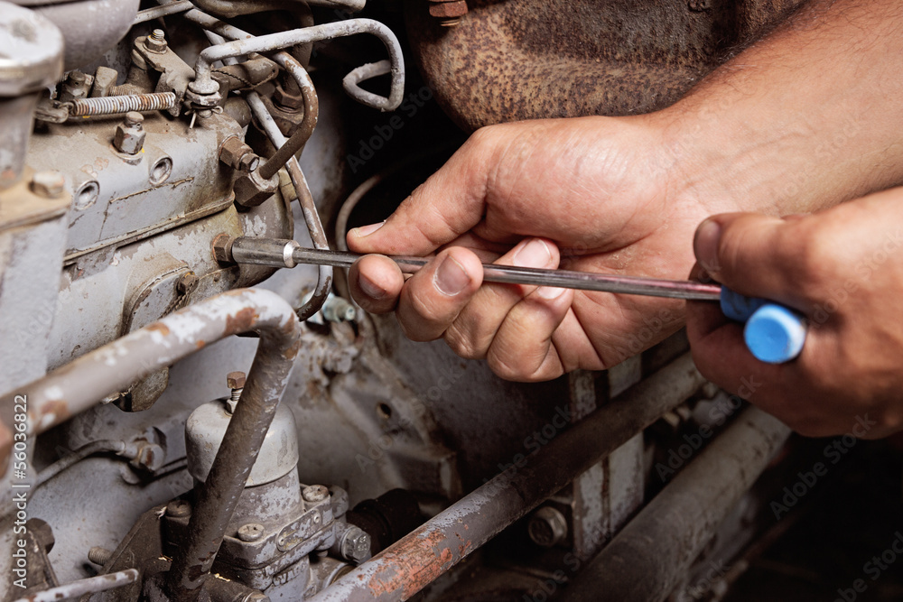 Fototapeta premium Engine service. Worker hands.