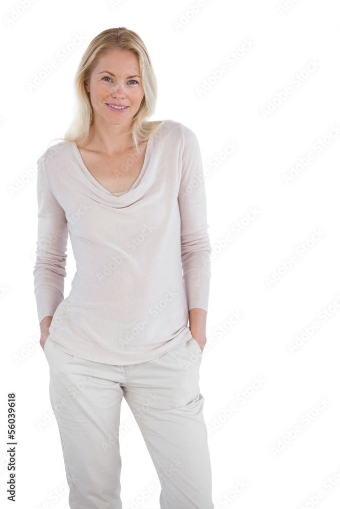 Smiling blonde woman posing for the camera Smiling blonde woman posing for the camera