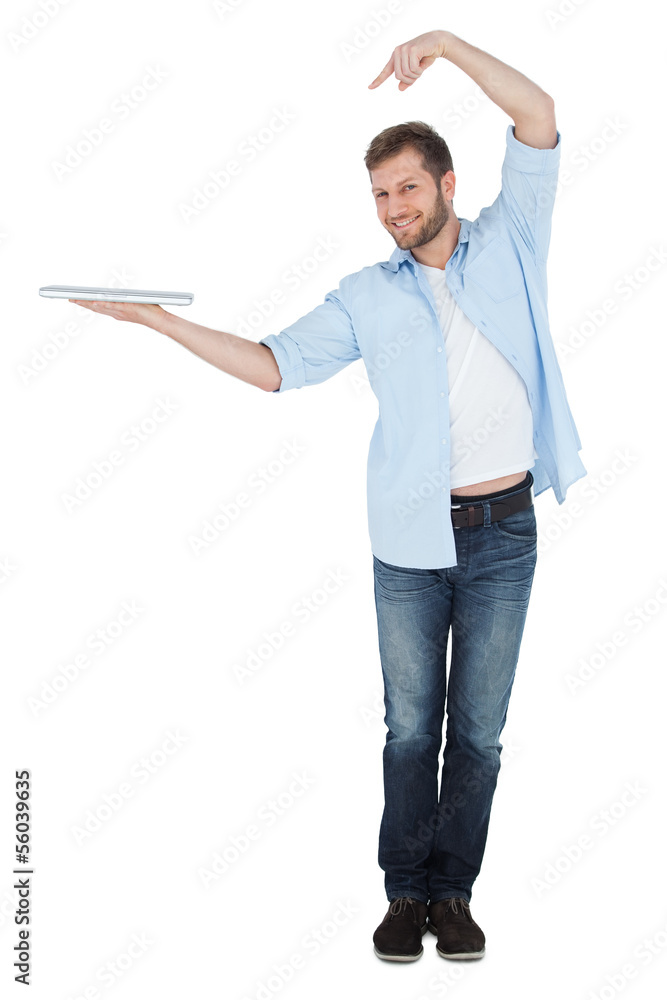 Happy model holding laptop on right hand with flair Happy model holding laptop on right hand with flair