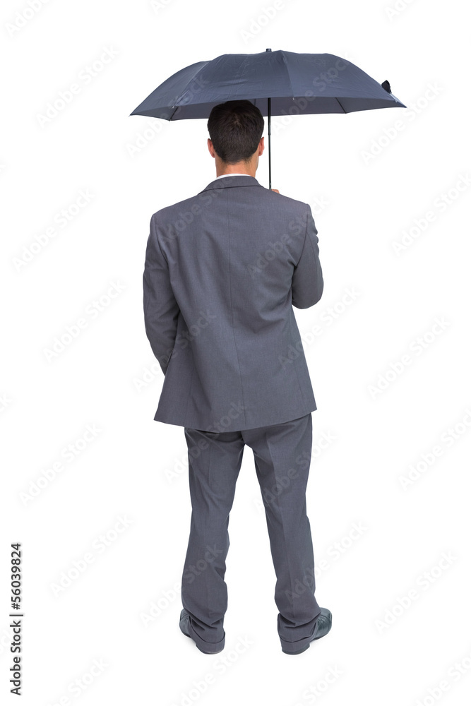 Rear view of classy businessman holding grey umbrella Rear view of classy businessman holding grey umbrella