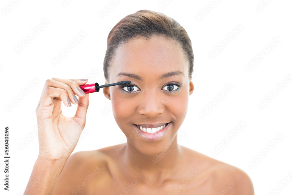 Smiling beautiful model applying mascara Smiling beautiful model applying mascara