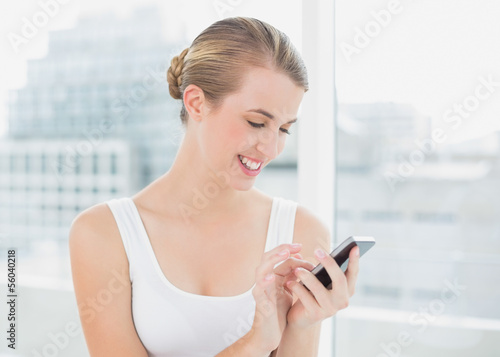 Cheerful blond woman text messaging Free Download Cheerful blond woman text messaging - GFXLoad