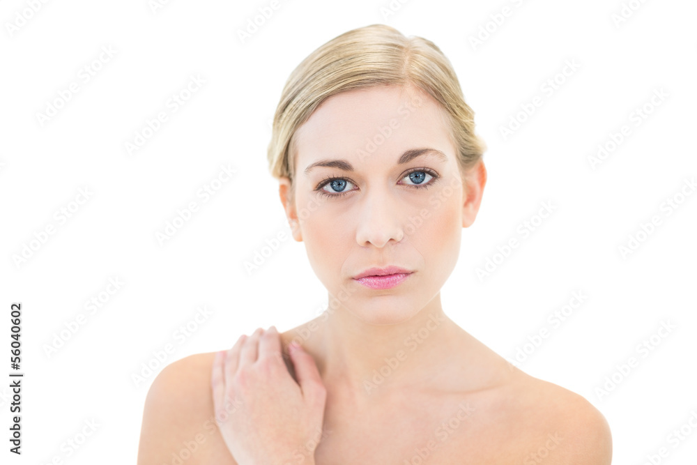 Stern young blonde woman looking at camera Stern young blonde woman looking at camera