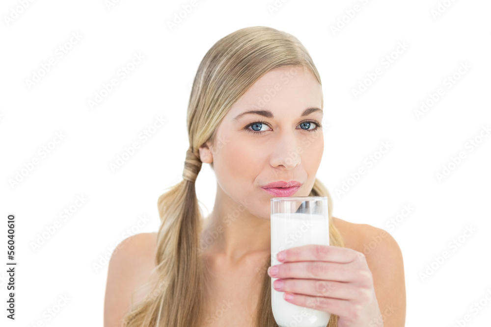 Charming young blonde woman sipping milk Charming young blonde woman sipping milk