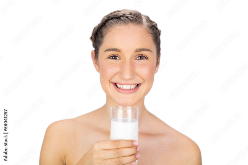 Smiling young model holding glass of milk Smiling young model holding glass of milk