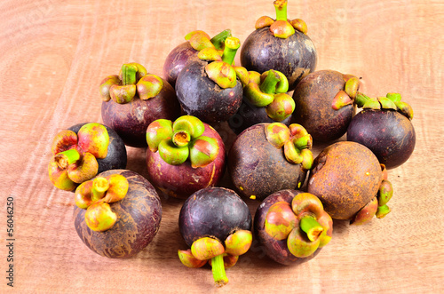 Fresh fruit in a basket on a wooden floor