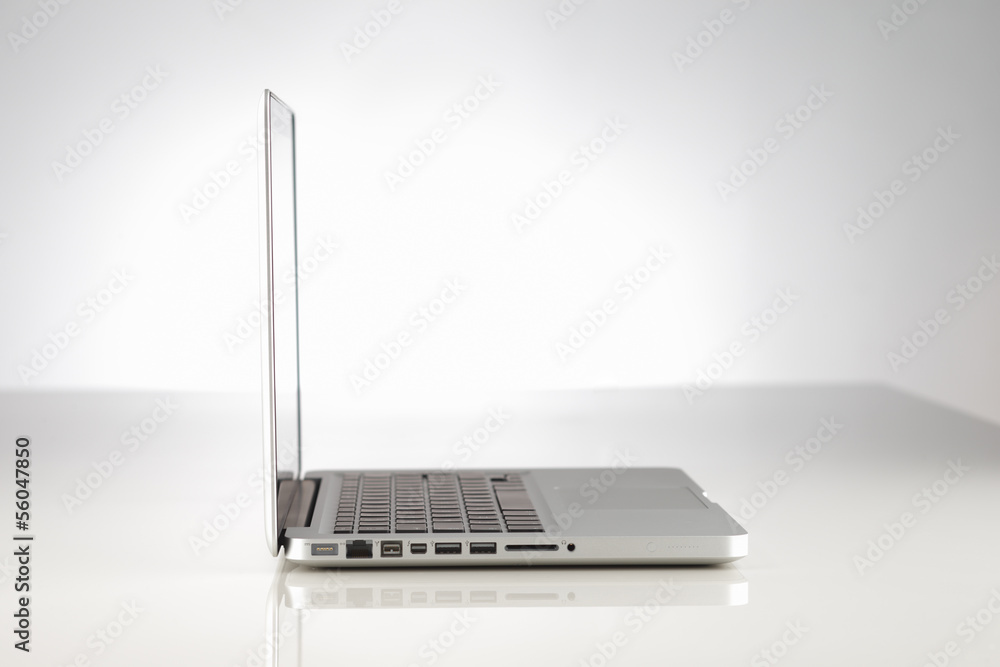 A beautifully lit modern alloy laptop computer A beautifully lit modern alloy laptop computer