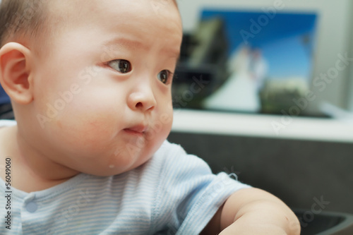 Closeup photo of beautiful cute asian baby expression