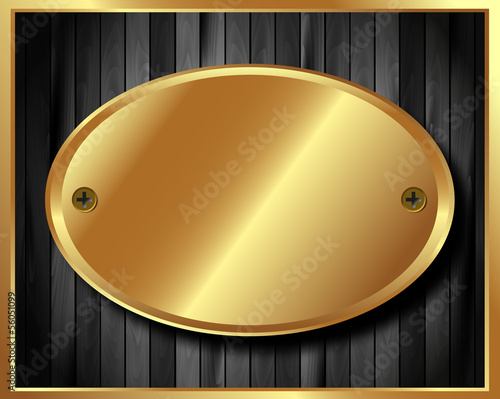 Gold plate on dark wooden background