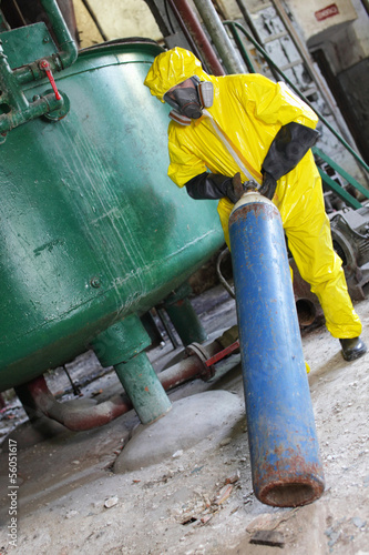 technician in  uniform,  dealing with steel cylinder wh gas