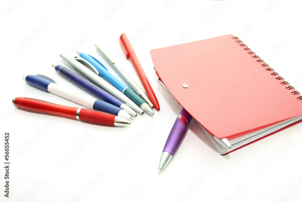 Set of office pens and red notebook Set of office pens and red notebook