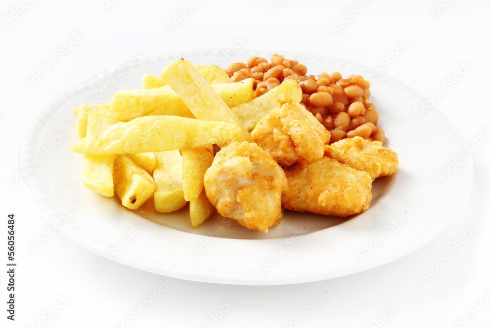 chicken nuggets, chips and beans on white plate chicken nuggets, chips and beans on white plate