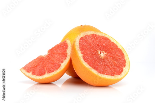 Studio shot of three juicy grapefruits isolated on white