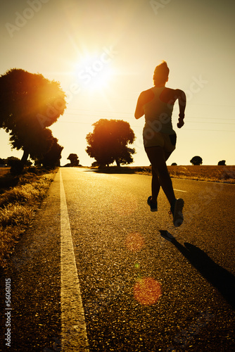 Woman running on sunset