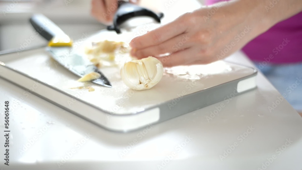asian woman slicing ginger with forward dolly shot asian woman slicing ginger with forward dolly shot