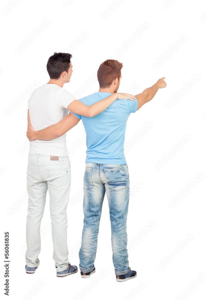 Couple of best friends pointing something Couple of best friends pointing something