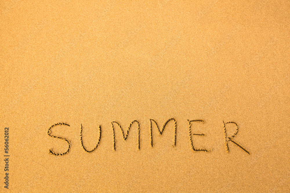 Summer, text written by hand in sand on a beach. Summer, text written by hand in sand on a beach.