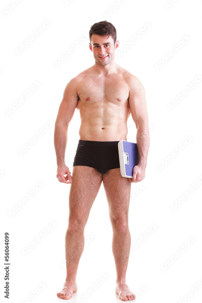 Healthy young man with a weight scale Isolated Healthy young man with a weight scale Isolated