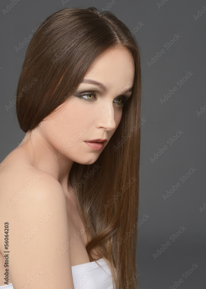 young sexy girl with long hair on black background