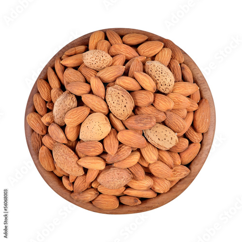Almonds in a wooden bowl on a white background