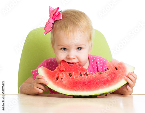 little girl eating watermelon
