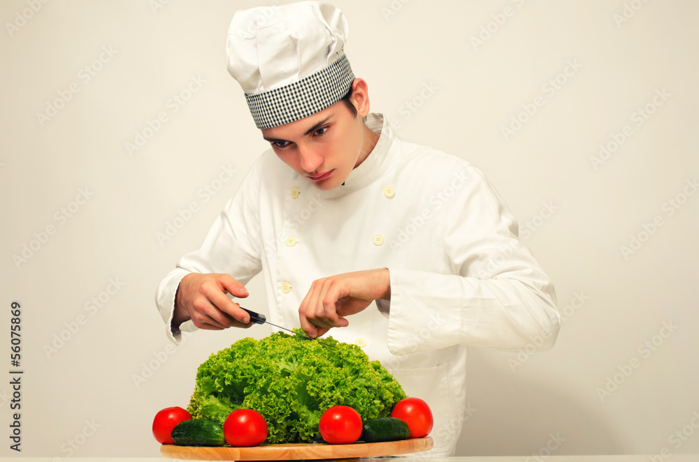 Chef preparing a green salad for a perfect healthy life Chef preparing a green salad for a perfect healthy life