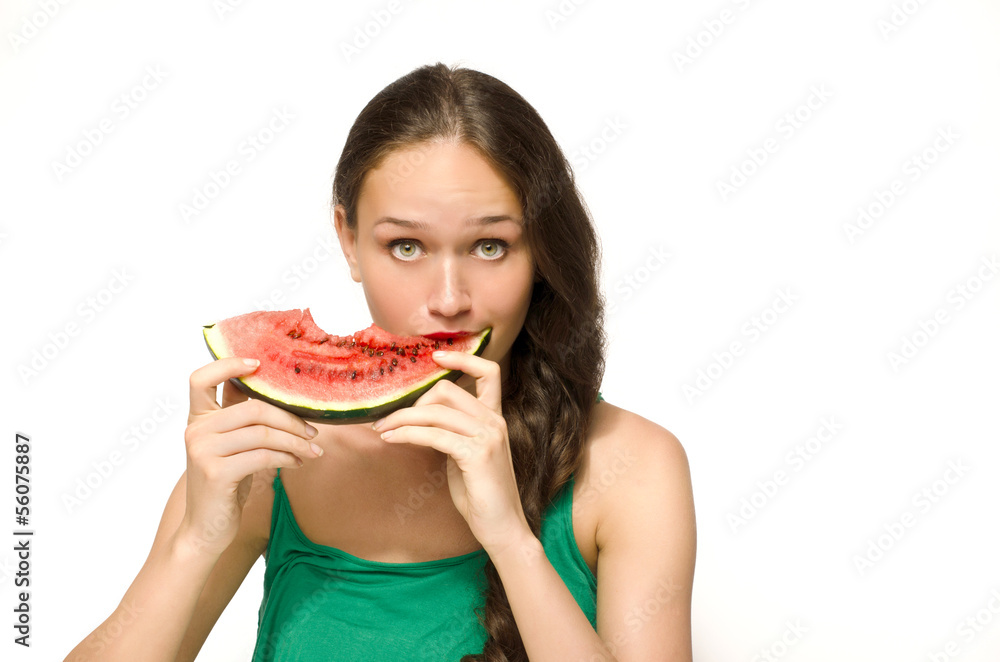 Beautiful woman eating a green ripe melon slice Beautiful woman eating a green ripe melon slice