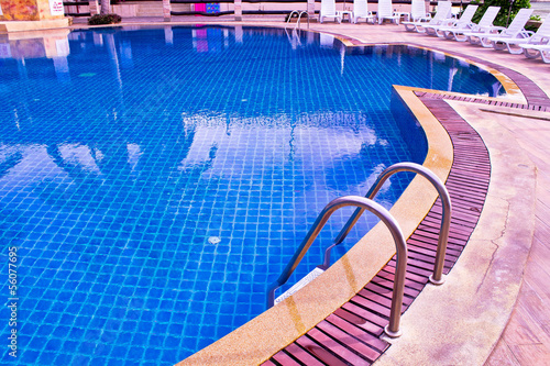 Hotel swimming pool with sunny reflections